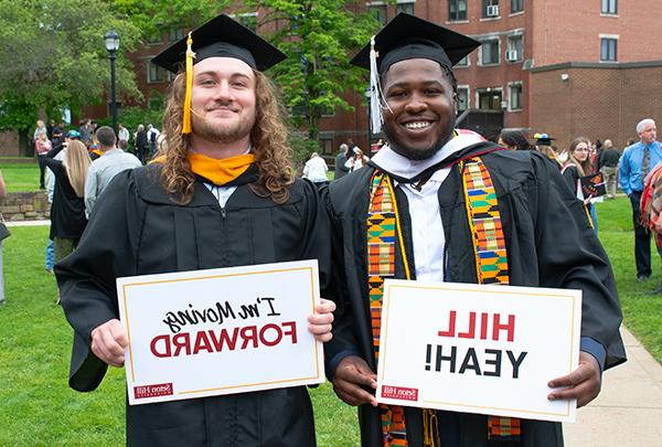 students celebrating graduation